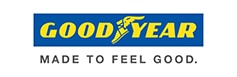 Logo Goodyear, le slogan Made to Feel Good Logo Goodyear jaune et bleu, avec le pied ailé, et le slogan « MADE TO FEEL GOOD. » en dessous.