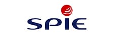 Logo SPIE : Services énergétiques et numériques Logo SPIE bleu marine avec un cercle rouge contenant des lignes blanches stylisées représentant une structure ou un éventail au-dessus du texte SPIE.
